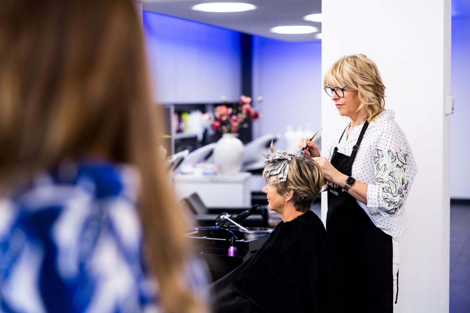 Werknemers van High Hair aan het werk
